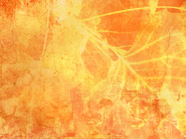 Grunge background texture in yellow orange fall colors with abstract leaves - Photo, Image