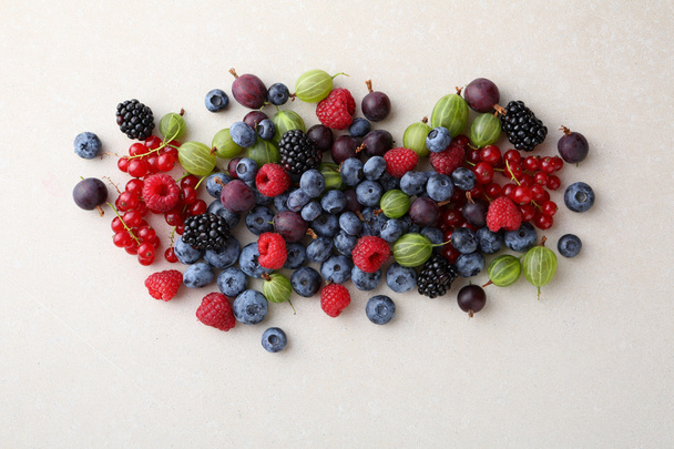 Fresh summer berries on concrete background - 写真・画像