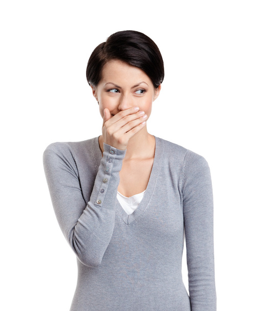 Woman giggles covering her mouth - Fotoğraf, Görsel
