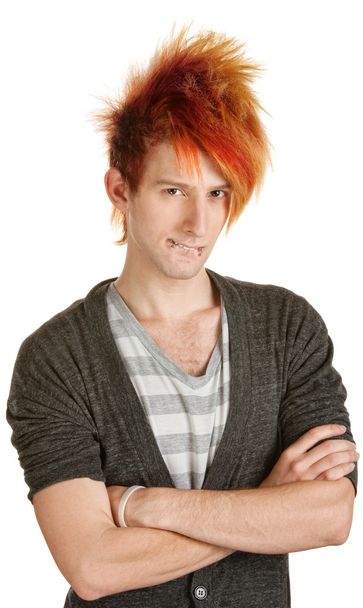 man in oranje haren bijten zijn lippen - Foto, afbeelding