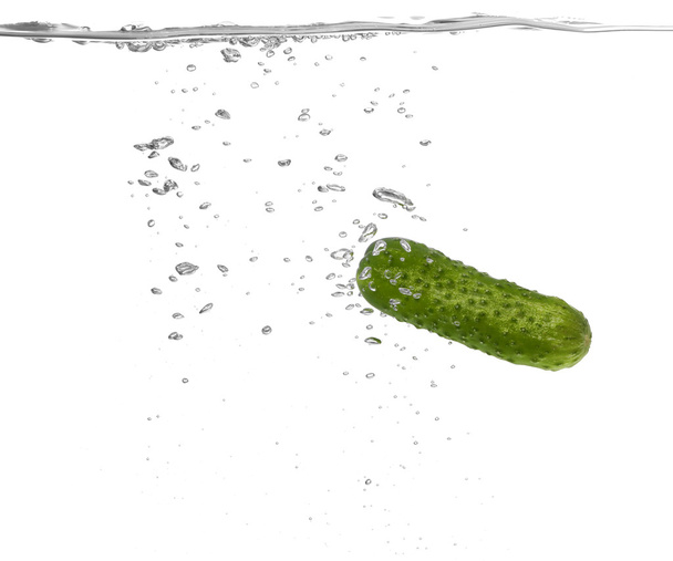 Fresh cucumber falling in water  - Fotoğraf, Görsel