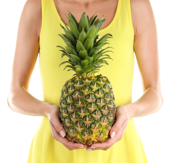 Woman holding pineapple  - Фото, изображение