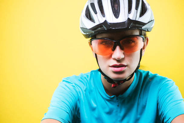 Close-up portrait of female cyclist - Фото, изображение