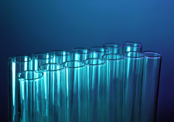Test tubes on blue   - Фото, изображение