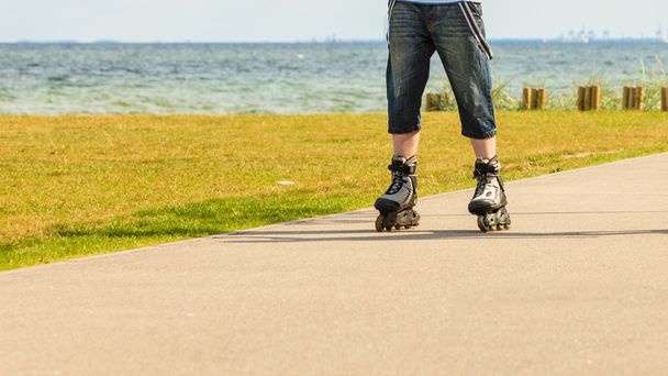 Young man rollerblading outdoor on sunny day - Fotoğraf, Görsel