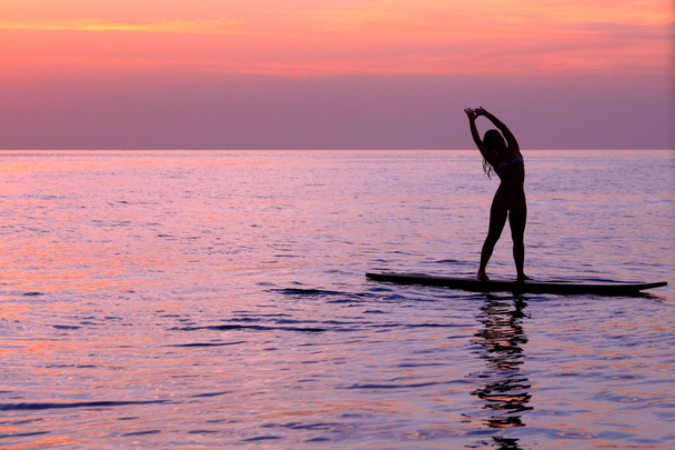 Woman doing yoga asanas - Фото, зображення