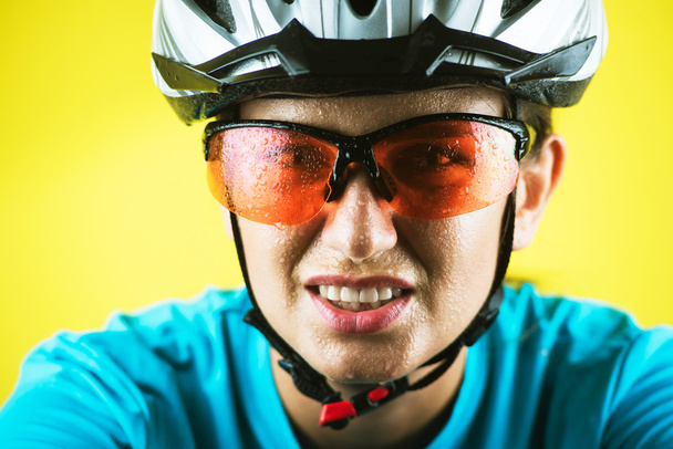 Close-up portrait of female cyclist - Photo, image