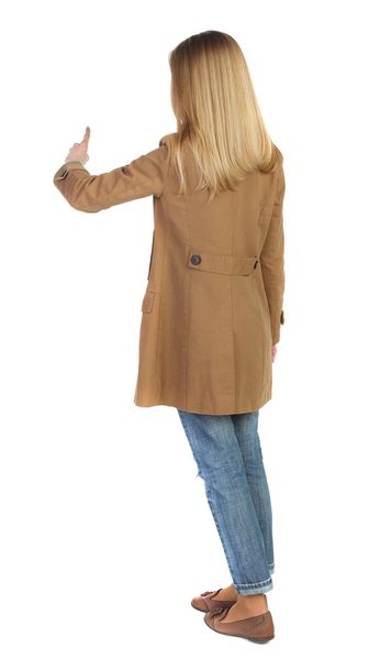 Back view of  pointing young women in parka. - Photo, Image