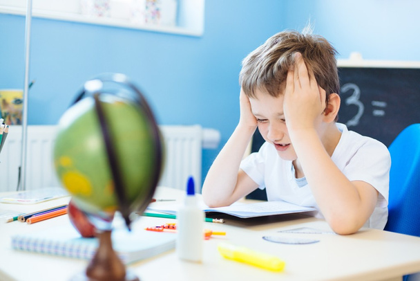 Child thinking about homework solution. - Photo, Image