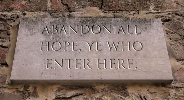  Abandon all hope, ye who enter here. From Dante's Divine Comedy. Engraved text. - Photo, Image