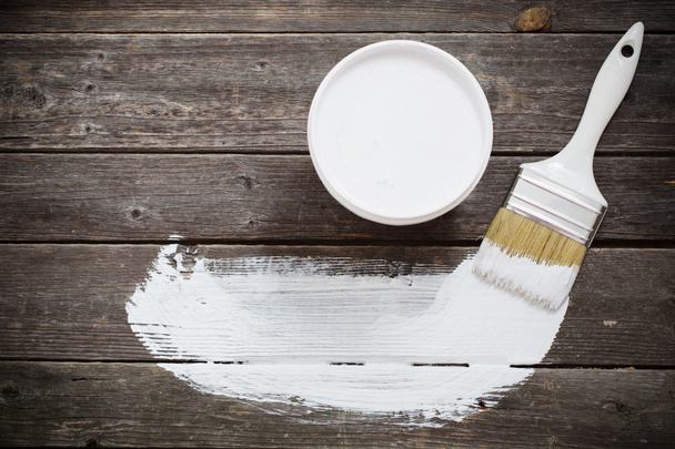 Bank paints and brush on a wooden background - Foto, Imagen