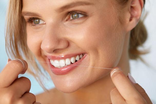 Dental Health. Woman With Beautiful Smile Flossing Healthy Teeth - Photo, Image