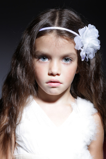 Portrait of young beautiful little girl with dark hair - Φωτογραφία, εικόνα