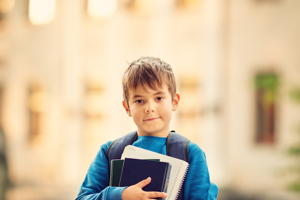 Boy with rucksack infront of a school building - Foto, Imagen
