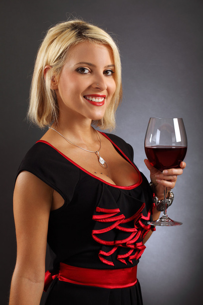 Sexy blond drinking red wine - Foto, afbeelding