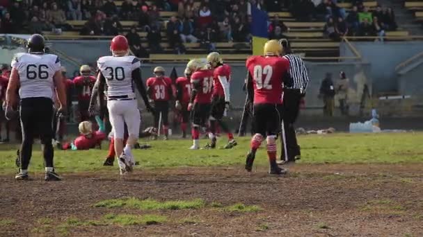 End of match half in American football, rival teams exchanging sides of field - Footage, Video