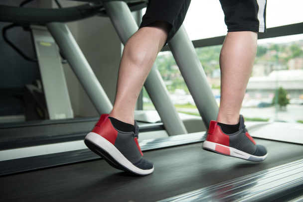 Close-Up Man Feet On Treadmill - Photo, image