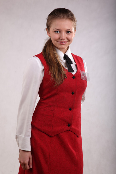 красива дівчина в уніформі і з значком
 - Фото, зображення