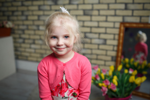 Portrait of a beautiful little girl with flowers - Φωτογραφία, εικόνα