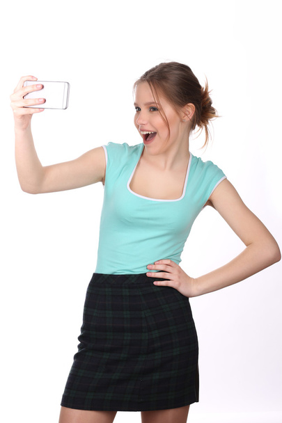 Smiling model taking selfie. Close up. White background - Fotoğraf, Görsel