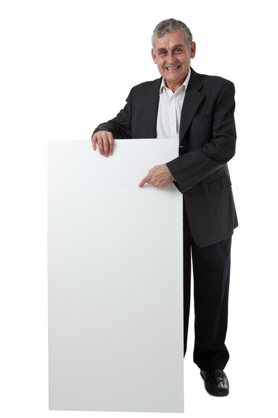 Empresário segurando um sinal em branco na frente dele
 - Foto, Imagem