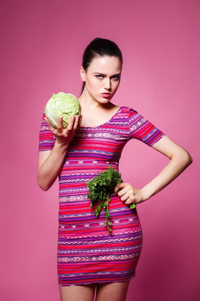 beautiful cheerful girl with cabbage and parsley in the Studio  - Fotografie, Obrázek
