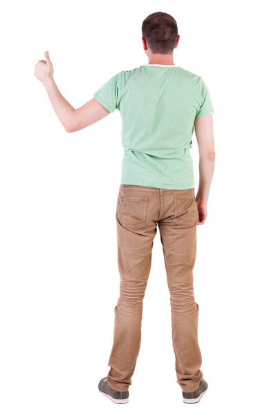 Back view of  man in green t-shirt shows thumbs up - Fotoğraf, Görsel
