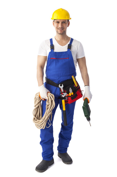 Construction worker holding drill - Фото, зображення