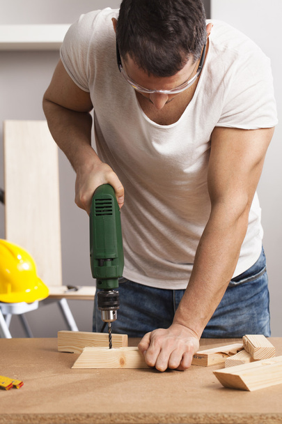 Craftsman or DIY man working with power drill - Fotoğraf, Görsel