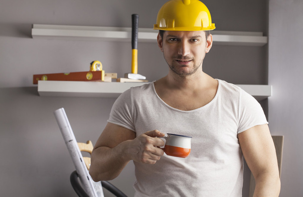 Handyman having a coffee break - Фото, изображение