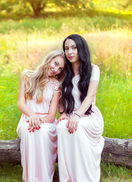 Portrait of happy young mother and lovely daughter. - Photo, image