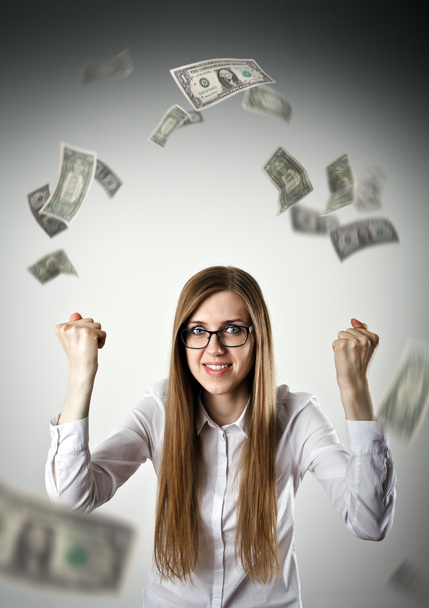 Rejoicing. Woman in white and dollars. - Фото, изображение