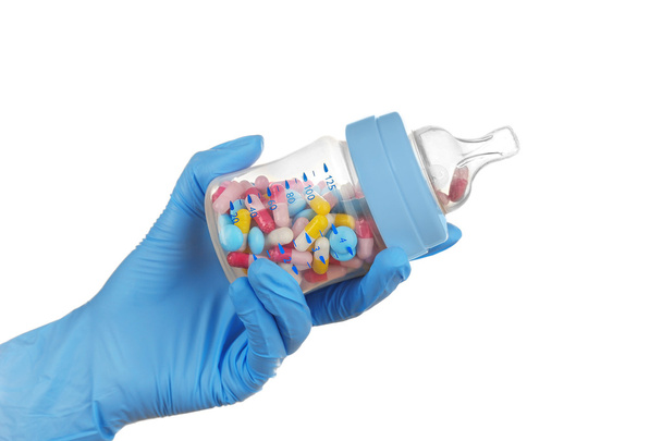 feeding bottle full of pills - Фото, изображение