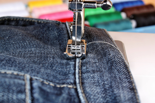 Sewing machine and item of clothing material - Photo, Image