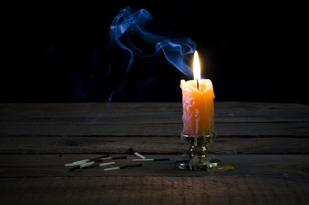 Candle, flame, smoke, burnt matches. - Foto, imagen