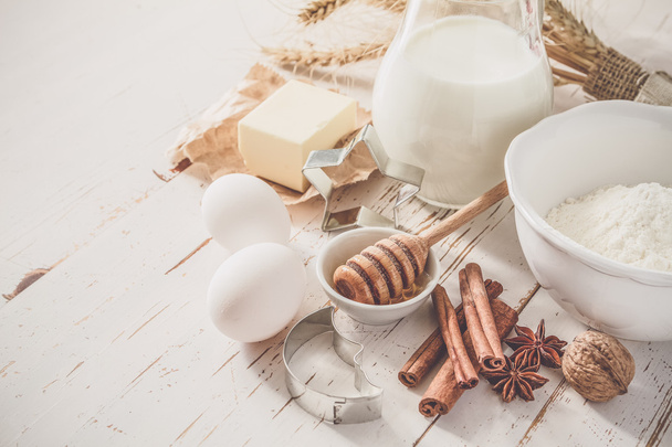 Ingredients for baking - milk, butter, eggs, flour, wheat - Фото, изображение