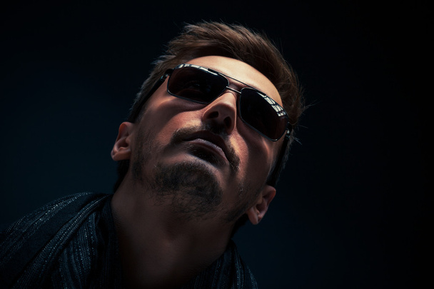 Portrait of a handsome guy, wearing sunglasses - Photo, Image