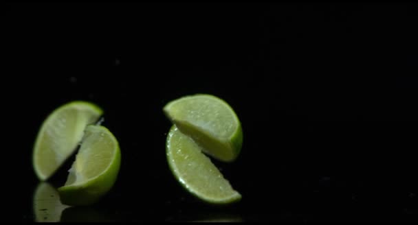 Lime splits into segments on a black background - Footage, Video