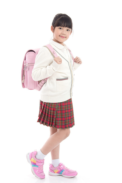 asiático criança no escola uniforme com escola saco no branco backgroun
 - Foto, Imagem