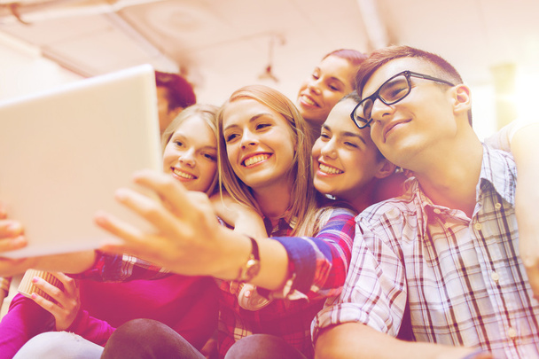 group of smiling students with tablet pc - Foto, Bild