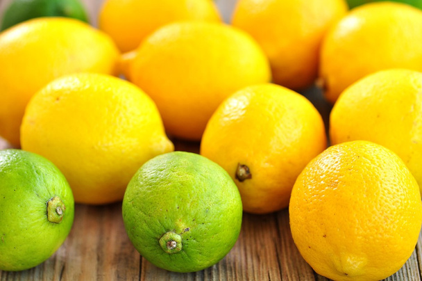 Organic lemons on a wooden background. Vintage style. - Φωτογραφία, εικόνα