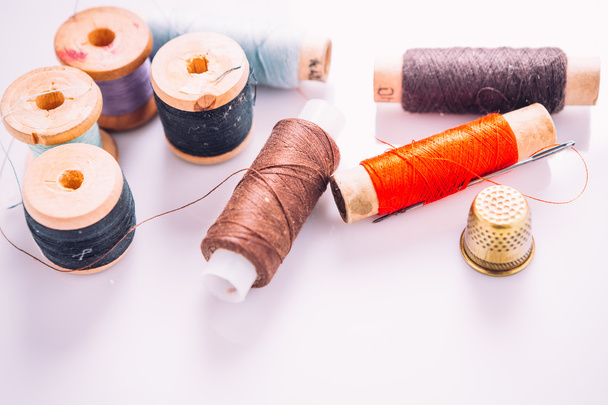 spool of thread on a light colored background - Photo, Image
