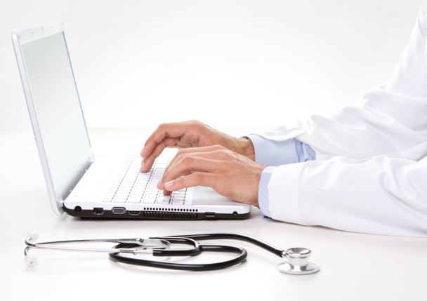 Doctor working on a laptop - Photo, Image