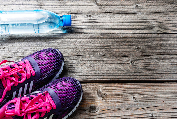 Sports runners and a bottle of water - Photo, image