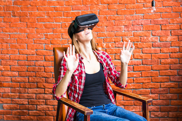 technology, entertainment and people concept - happy young woman with virtual reality headset or 3d glasses - Photo, Image