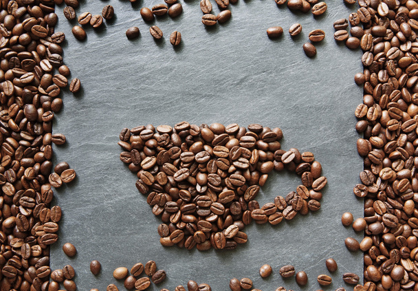 Tazza da chicchi di caffè su sfondo di pietra
 - Foto, immagini