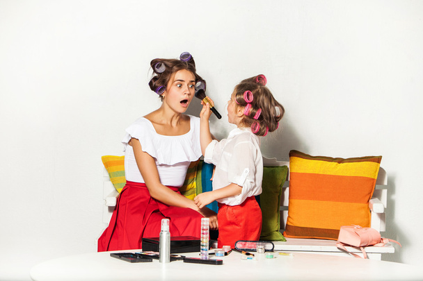 Little girl playing with her moms makeup - Foto, Imagem