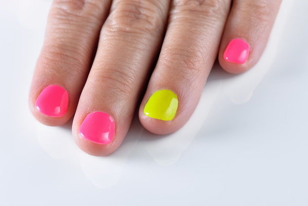 Rainbow pastel manicure. New Hybrid nails on white background - Photo, Image