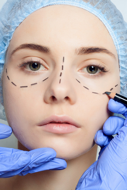 Beautiful young woman perforation lines plastic surgery operatio - Фото, изображение