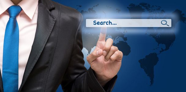 Businessman touching virtual searching bar  - Фото, изображение